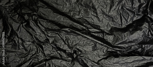 black plastic background, crumpled plastic bag texture