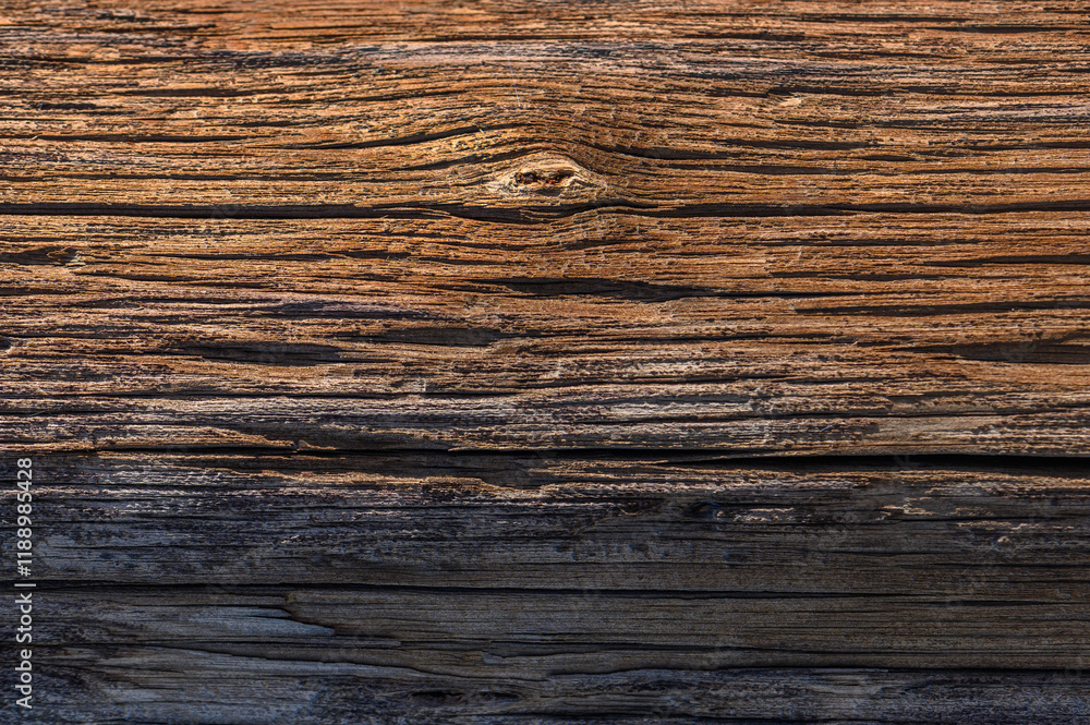 Weathered wooden surface showcasing rich textures and earthy tones in natural light Weathered wooden surface showcasing rich textures and earthy tones in natural light