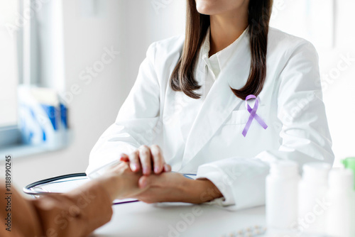 Female doctor in white coat with purple ribbon talking with patient. Alzheimer's disease, Pancreatic cancer, Hodgkin's Lymphoma awareness photo