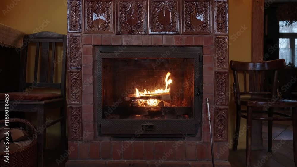 Wood burning in the fireplace in the interior of old European house