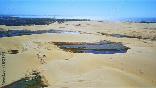 Aerial view from the beach, with dunes and ponds inside. Paracuru, Ceara, Brazil.