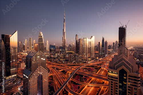 Fotografía Aerial view of Burj Khalifa and Dubai downtown skyline at sunset, Dubai financial center, luxury skyscrapers and main traffic intersection