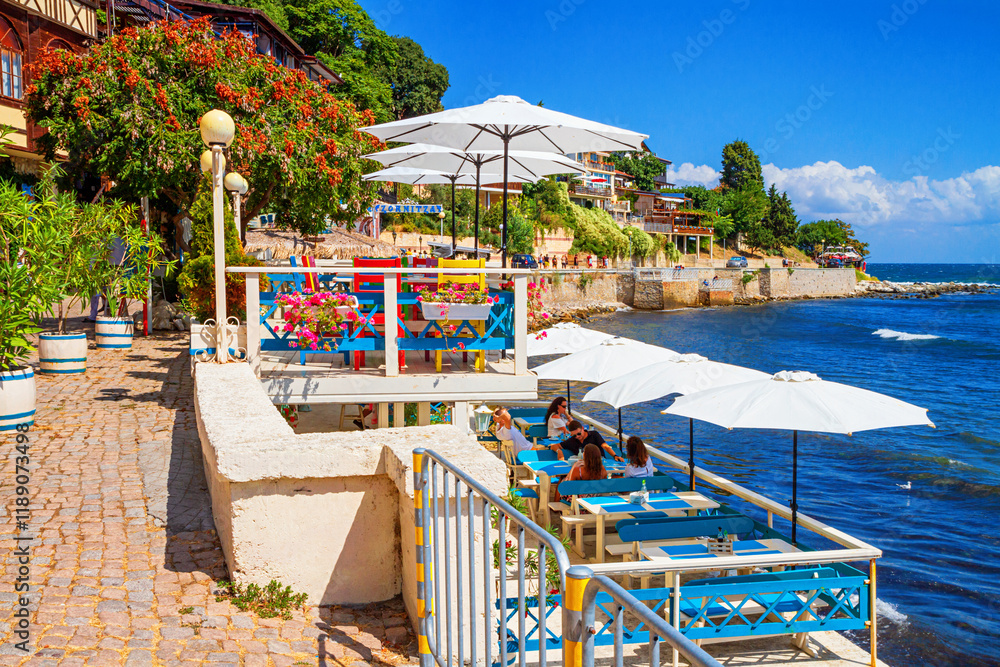 Seaside landscape - view of the cafe on the embankment by the sea, in the Old Town of Nessebar, on the Black Sea coast of Bulgaria
