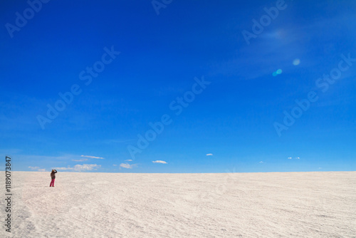 Obraz na płótnie Arctic winter landscape, panorama, banner - view of a snowy desert field and girl looking at the sky in the rays of the winter sun w salonie