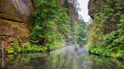 Obraz na płótnie Summer natural landscape - view of the river with a boatman in the Elbe Sandstone Mountains, Bohemian Switzerland, the north-western Czech Republic w salonie