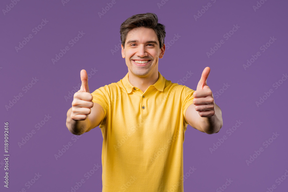 Positive smiling man with hand sign like, thumb up gesture. Happy guy on violet Positive smiling man with hand sign like, thumb up gesture. Happy guy on violet