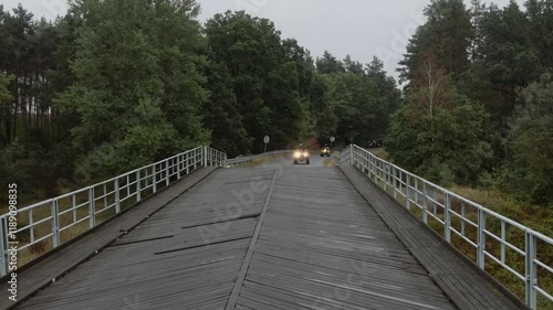 Quads driving over the bridge.