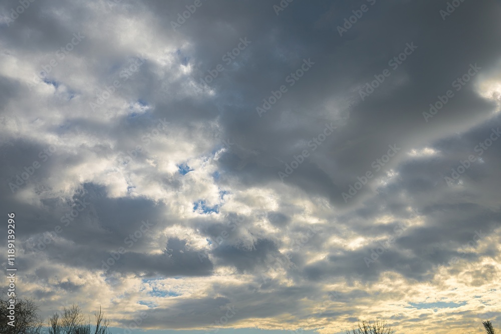 Cloudy Sky with Clearings and Sunlight on the Horizon Cloudy Sky with Clearings and Sunlight on the Horizon