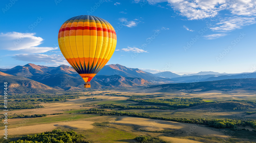 Fototapeta premium vibrant hot air balloon soaring over scenic mountains