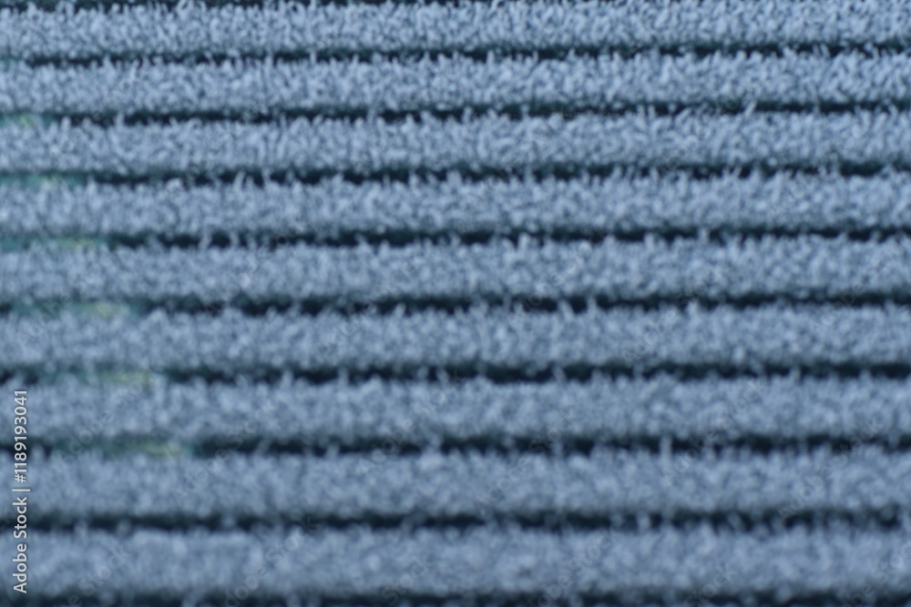 Car windshield defrosting and leaving a striped pattern in the frost (Macro) Car windshield defrosting and leaving a striped pattern in the frost (Macro)