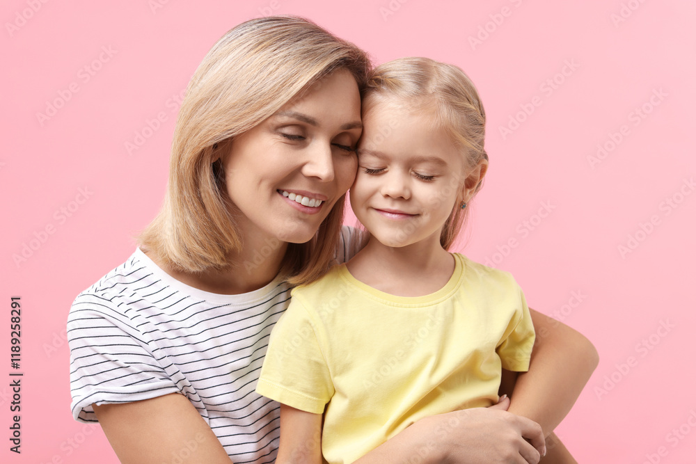 Cute little girl with her mom on pink background. Happy Mother's Day Cute little girl with her mom on pink background. Happy Mother's Day