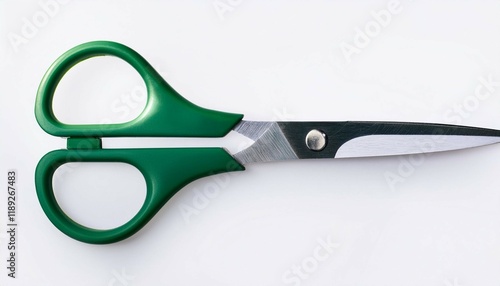 green handled scissors isolated with white background photo