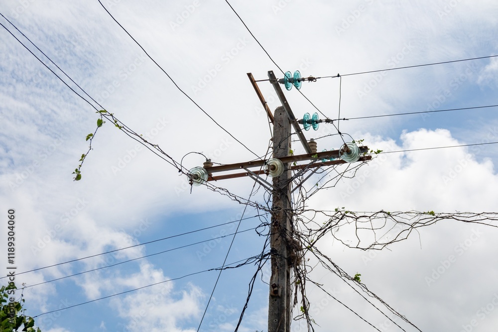 Electricity in Cuba, electrical pylon with messy wires Electricity in Cuba, electrical pylon with messy wires