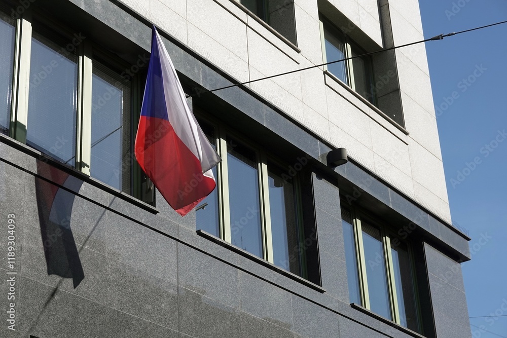 Czech national flag waving on modern building, marble wall