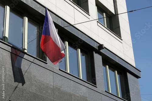 Czech national flag waving on modern building, marble wall photo