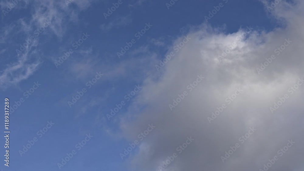 Timelapse cloudy sky with clouds passing over blue sky. Concept: Timelapse, clouds, nature. Timelapse cloudy sky with clouds passing over blue sky. Concept: Timelapse, clouds, nature.