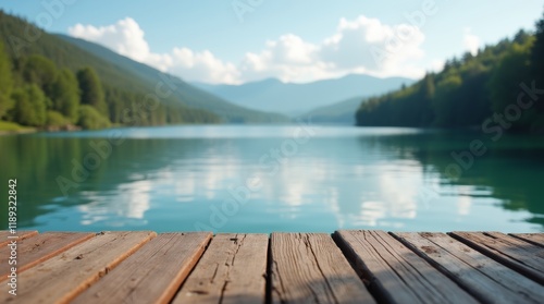 Fototapeta Naklejka Na Ścianę i Meble -  View of a lake from a wooden dock, great for outdoor scenes and nature-inspired designs 