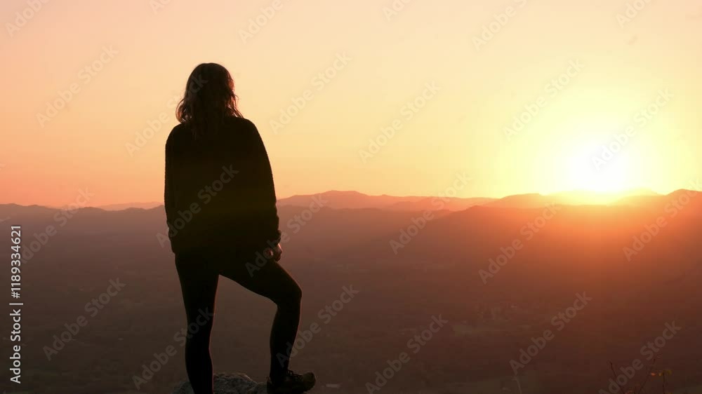 Vertical screen Woman Watching Sunset from Buffalo Mountain Park woman stands rocky ledge, gazing golden sunset Buffalo Mountain Park, Tennessee, symbolizing peace connection with nature. Vertical screen Woman Watching Sunset from Buffalo Mountain Park woman stands rocky ledge, gazing golden sunset Buffalo Mountain Park, Tennessee, symbolizing peace connection with nature.