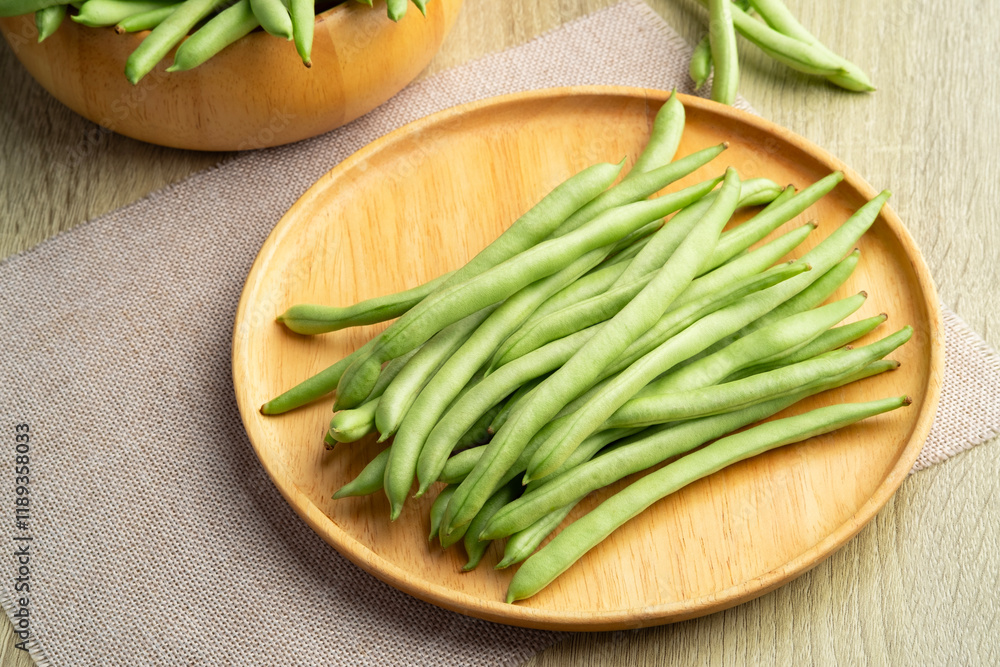 Common bean,Bush beans are french green beans in wooden plate. Common bean,Bush beans are french green beans in wooden plate.