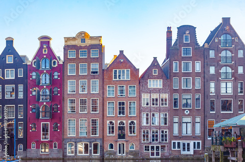 Photography Colourful houses of central Amsterdam among a canal.