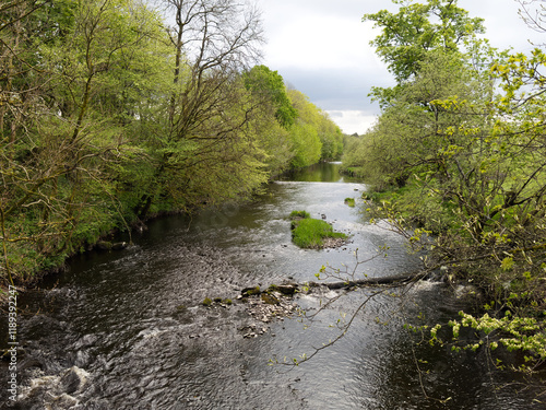 River Gryfe fast flowing due to high water level photo