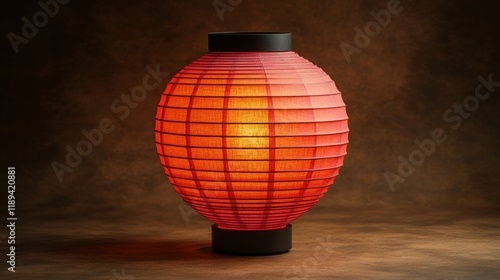 Red paper lantern hanging in dim light creating a cozy atmosphere in a tranqu...