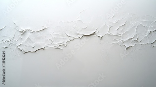 Natural light casting shadows in an empty room with dark walls and a large wi...