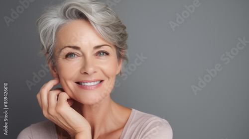 Close up photo of an older woman with beautiful skin, smiling happily. Straight face photo.