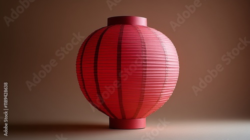 Red paper lantern hanging in dim light creating a cozy atmosphere in a tranqu...