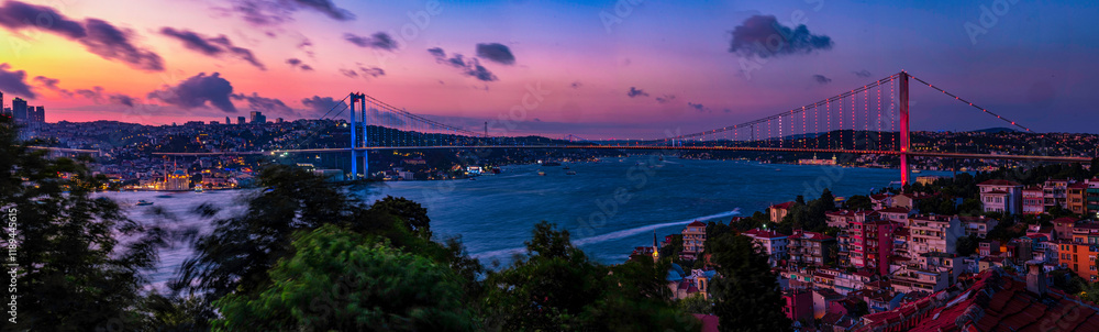 Fototapeta premium A breathtaking panoramic view of the Bosphorus Bridge in Istanbul at sunset.Istanbul's Bosphorus Bridge at Sunset: A Stunning Panoramic View. Best touristic destination Istanbul, Türkiye