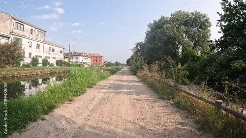 Via Alzaia Pavese along the canal near Binasco, province of Milan, Lombardy, Italy photo