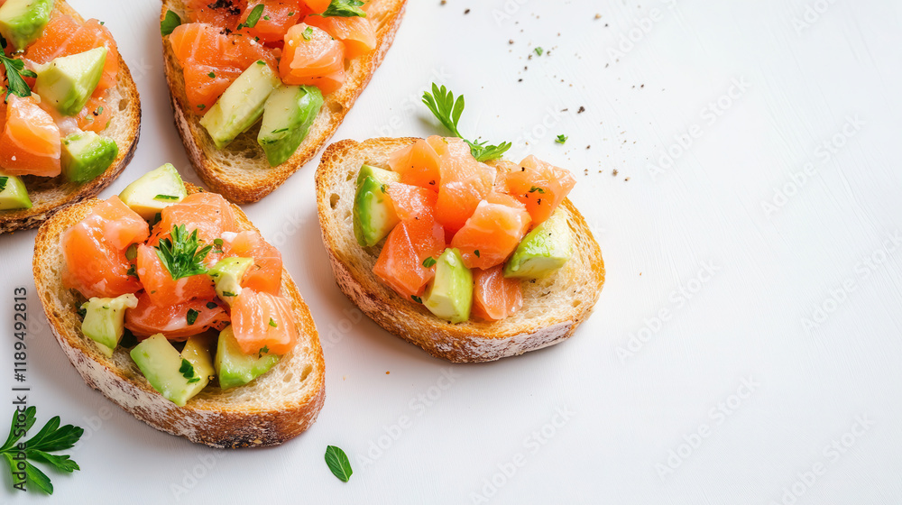 Open sandwich with smoked and salted salmon for healthy breakfast. Trout and avocado on bruschetta toast Open sandwich with smoked and salted salmon for healthy breakfast. Trout and avocado on bruschetta toast
