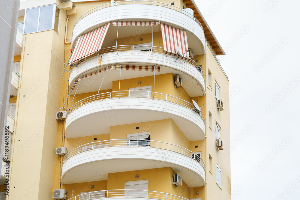 Fototapeta premium Modern minimalist apartment building in Mediterranean style with air conditioning in Albania on the sea coast. Concept of selling a house abroad, renting apartments