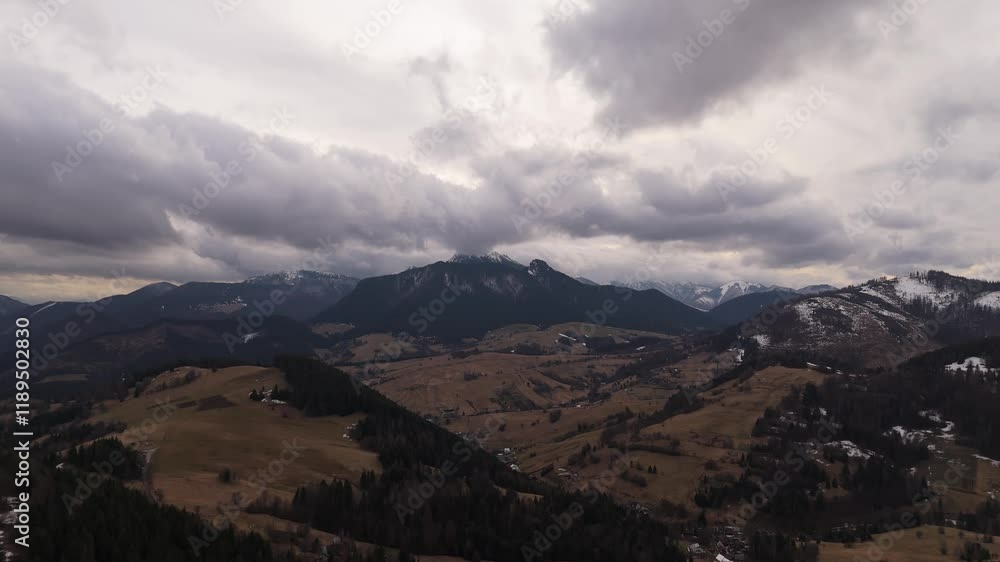 aerial view of mountain between winter and spring aerial view of mountain between winter and spring