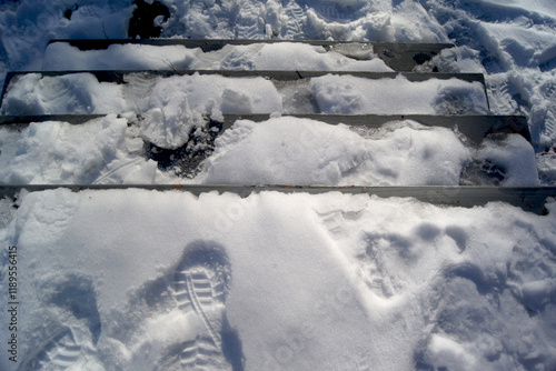 Footprints in snow on stairs
