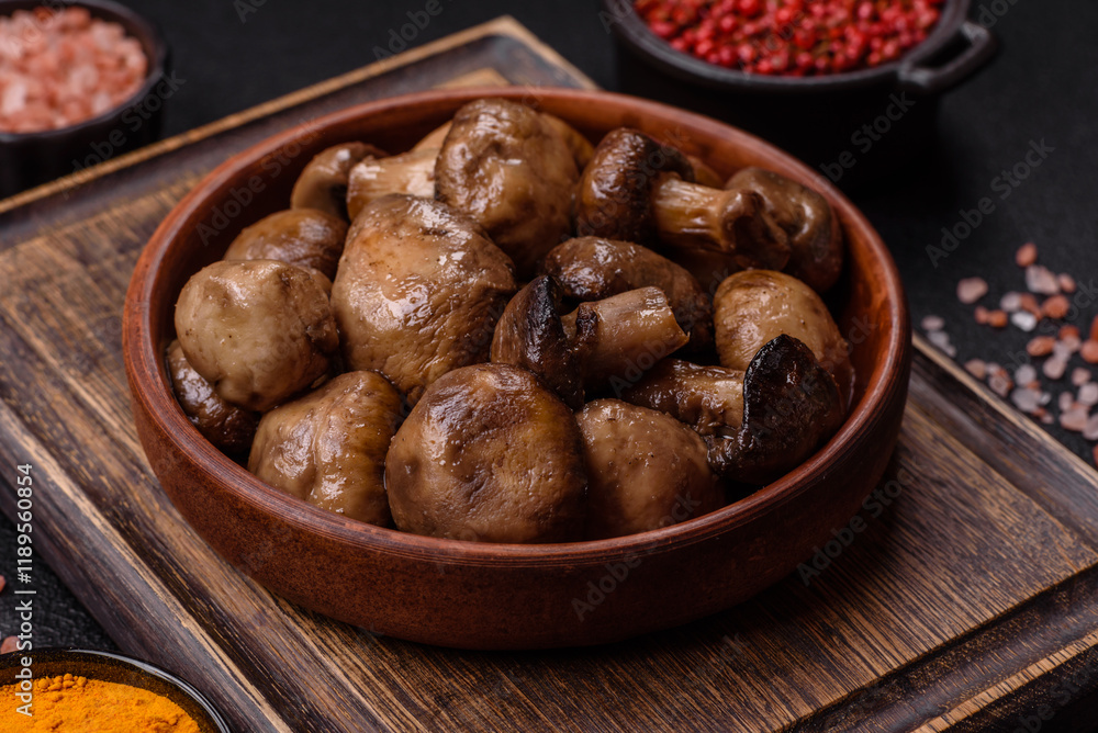 Grilled champignon mushrooms with salt, spices and herbs Grilled champignon mushrooms with salt, spices and herbs