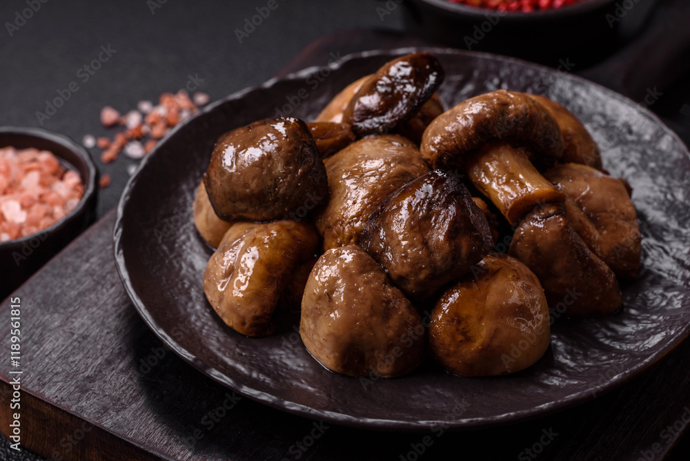 Grilled champignon mushrooms with salt, spices and herbs Grilled champignon mushrooms with salt, spices and herbs