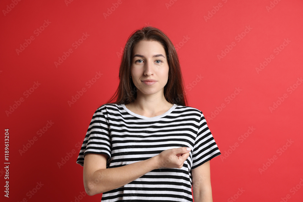 Fototapeta premium Woman making promise on red background. Oath gesture