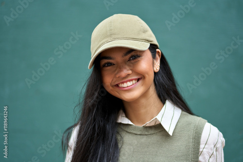 Εκτύπωση καμβά Smiling pretty gen z Asian teen girl fashion model looking at camera posing at color wall