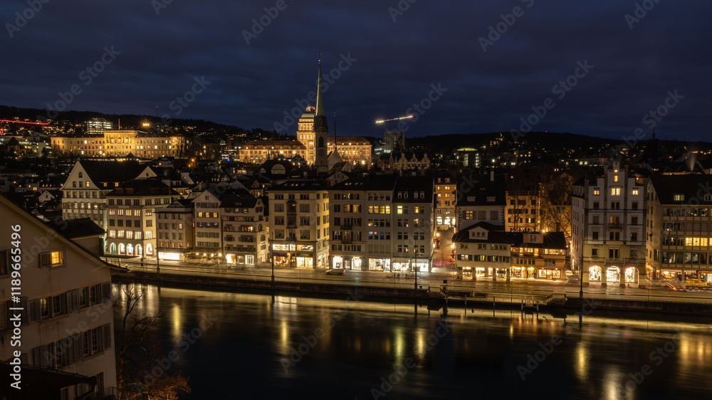 Nighttime View of Historic City Center with Illuminated Cathedral and Buildings in Zurich Nighttime View of Historic City Center with Illuminated Cathedral and Buildings in Zurich