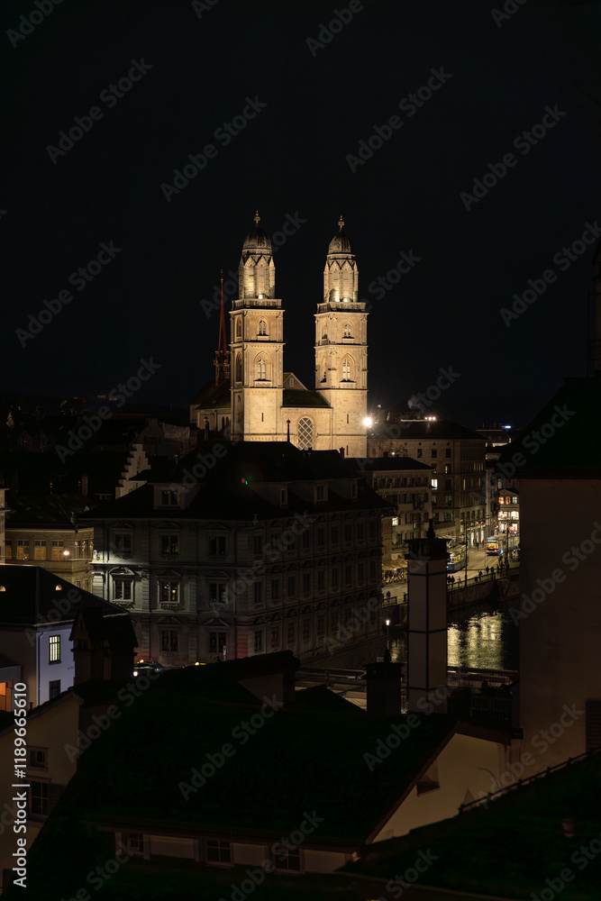 Nighttime View of Historic City Center with Illuminated Cathedral and Buildings in Zurich Nighttime View of Historic City Center with Illuminated Cathedral and Buildings in Zurich