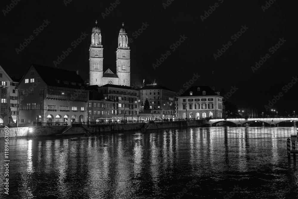 Nighttime View of Historic City Center with Illuminated Cathedral and Buildings in Zurich Nighttime View of Historic City Center with Illuminated Cathedral and Buildings in Zurich