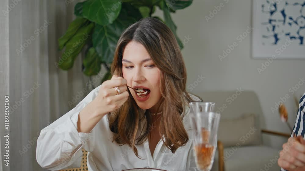 Friends eating birthday cake enjoying home party closeup. Relaxed woman talking Friends eating birthday cake enjoying home party closeup. Relaxed woman talking