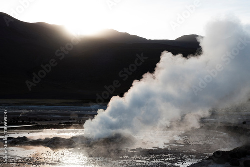 Sunrise and geyser in El Tatio photo