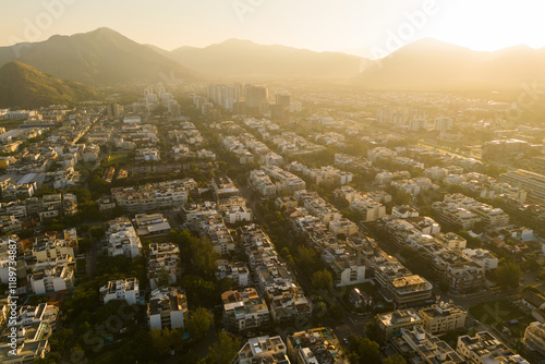 Aerial View of Luxury Apartment Buildings in Recreio dos Bandeirantes Region in Rio de Janeiro With Sunset Over Hills photo