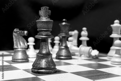Chessmen photographed on a chessboard with a dark background
