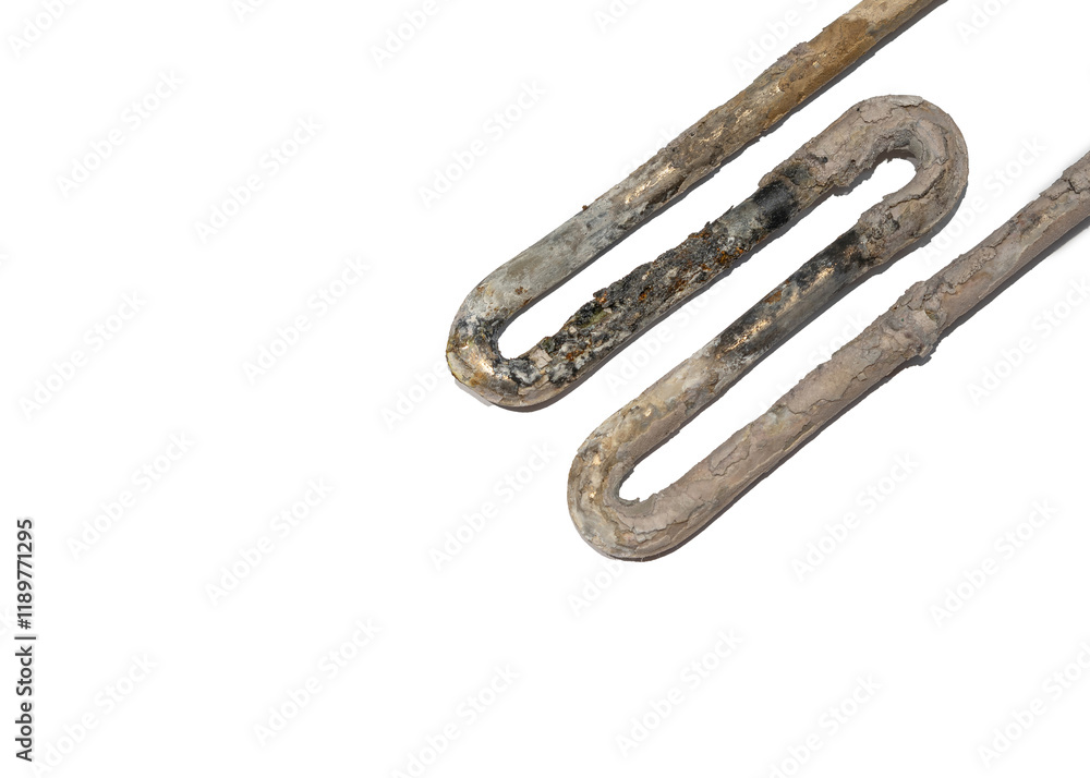 Close-Up of a Corroded Water Heater Element Covered in Thick Lime Scale Deposits isolated on white, Highlighting the Need for Regular Maintenance and Cleaning. Selective focus.