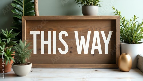 this way is boldly displayed in a rustic, hand-painted style on a wooden signboard background