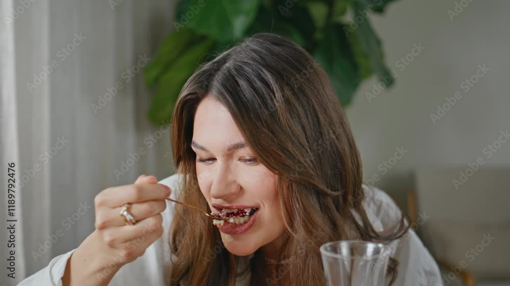 Joyful girl eating dessert at weekend meeting with friend closeup. Happy woman Joyful girl eating dessert at weekend meeting with friend closeup. Happy woman