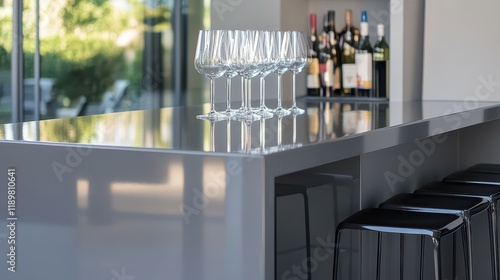 A sleek gray kitchen featuring a close-up view of a bar area, showcasing contemporary design with minimalist accents and modern finishes. photo